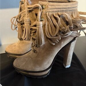 These authentic Brian Atwood Tan Lace Up Fringe Boots are perfect for fall.